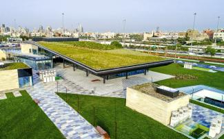 Pitched green roof, surrounded by lawn an walkways